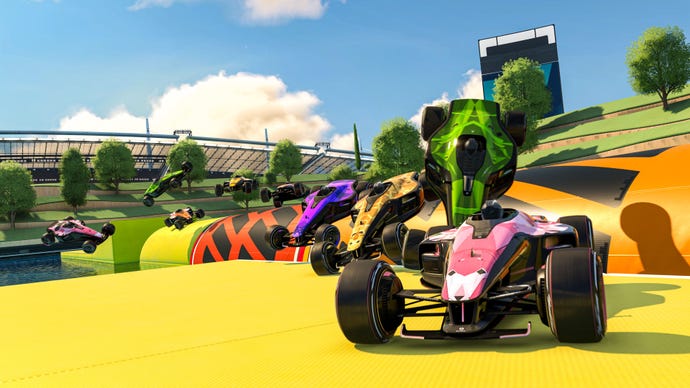 Many cars attempt to climb an obstacle in a bright course from Trackmania.