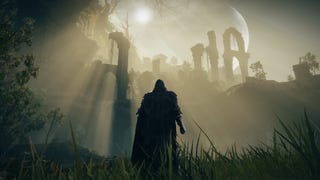 The player in Elden Ring: Shadow Of The Erdtree stands surveying the Ancient Ruins Of Rauh, bathed in sunlight.