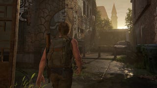 Abby walks down an alley while the sun sets behind a wall in The Last of Us 2 Remastered